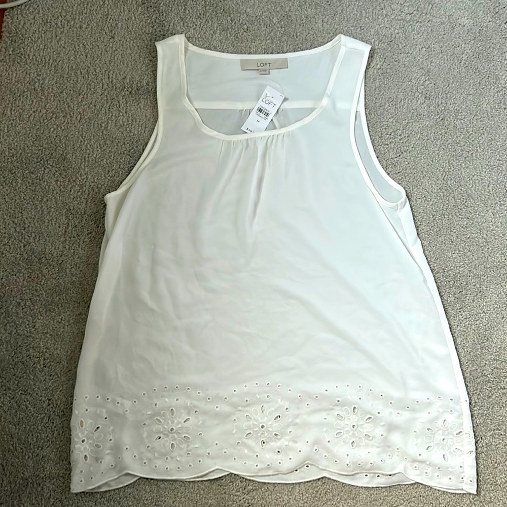 Loft white polyester tank with eyelet design.